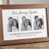 Personalized anniversary photo frame with 3 couple photos and custom date on wooden table